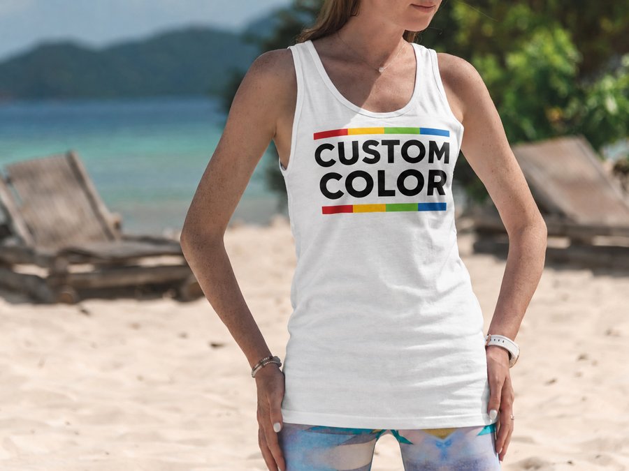 White tank top printed with the Custom Color logo on a beach